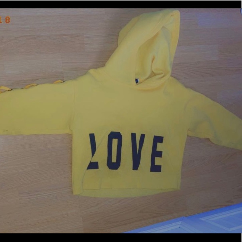Yellow cropped hoodie.